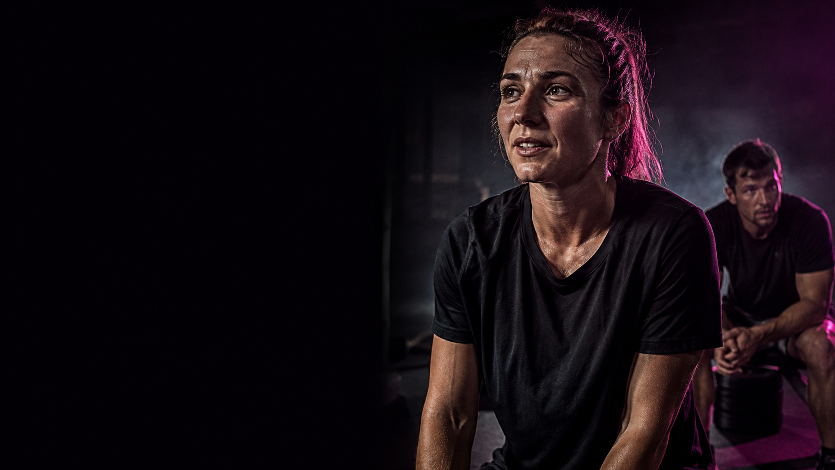 Two everyday athletes catch their breath after an honest training session